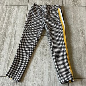 Ponytails black and white,(gold, black and white)strip on sides,long pants/girls